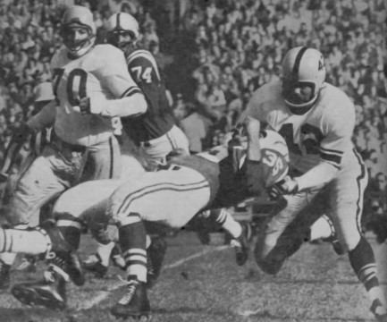 Steelers defensiveback Dick Alban (#42) bring Colts runner Alan Ameche's (#35) progress to an abrupt halt with a tackle that would surely draw a penalty today. Steelers great Ernie Stautner (#70) and Colts tackle Ken Jackson (#74) are also shown. 