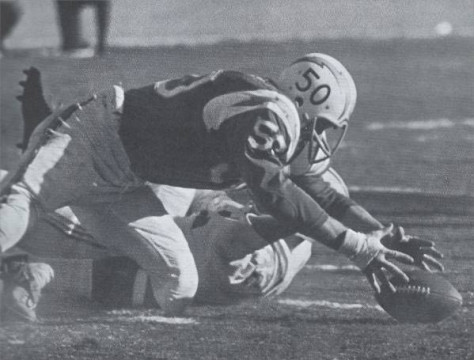 Chuck Allen recovers a fumble in the 1960 AFL Championship game against Houston.