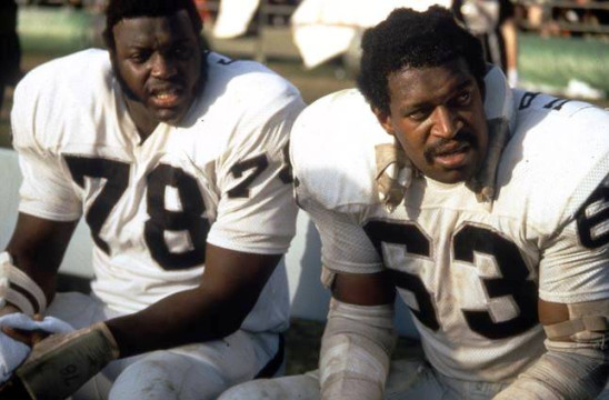 Oakland Raiders Greats Art Shell and Gene Upshaw on bench