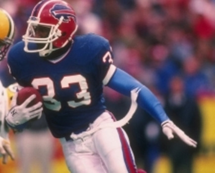 A first round draft pick of the Bills in 1986 Harmon played 4 seasons with them as a running back and kick returner. He was their leading ball carrier in 1987 with 485 yards and 2 rushing touchdowns. He was also the second leading receiver with 56 catches.
