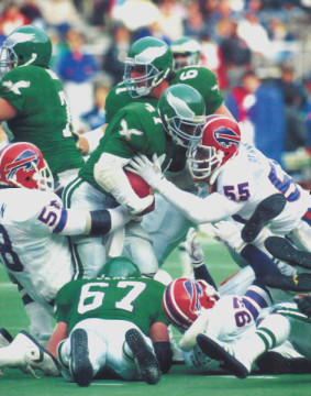 Shown here with fellow linebacker Shane Conlon (#58), the Bills defense takes down an Eagle runner during the last game of the 1987 season. Bennett had a monster game getting 4 sacks, 16 tackles and forcing 3 fumbles.