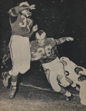 Pictured here with future Hall of Famer Ollie Matson the shifty Rams runner carries outside. A Pro-Bowler in 1961 he gained 609 yards and scored 4 touchdowns.