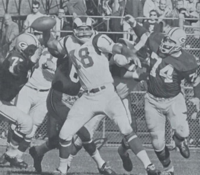 The Rams Roman Gabriel Under a Heavy Packers Rush
