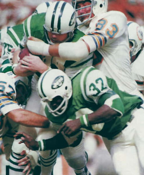 The Jets John Riggins is stopped by the Dolphins Vern den Herder & Mike Kolen in 1972