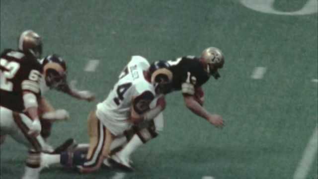 Unable to escape the clutches of the Rams defense, Saints QB Bobby Scott goes down.