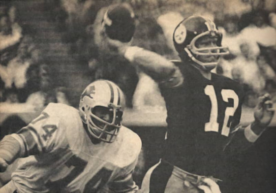 Larry Hand of the Lions applies pressure to Steelers QB Terry Bradshaw