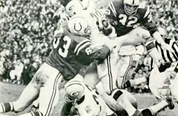Ted Hendricks with Mike Curtis stop a Green Bay runner in 1969