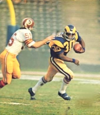 The Redskins Chris Hanburger in pursuit of Rams Lawrence McCutcheon