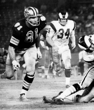 Big Doug Atkins - as a Saint around the end of his 17-year NFL career. Credited with 30 sacks during his last 3 years in the league. The Rams Les Josephson (#34) looks o n from a distance.  