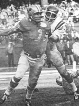 The Viking Hall of Fame lineman snatches Lions quarterback Bill Munson (#19).