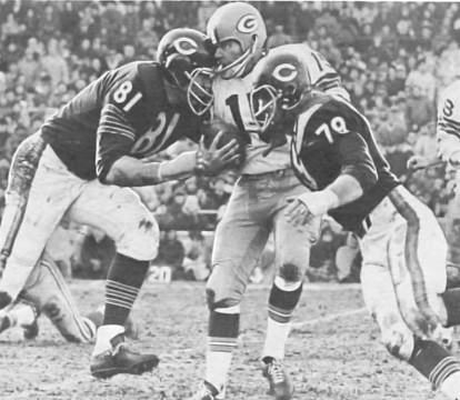 Bears defensive ends Doug Atkins (#81) & Dick Evey (#79) converge on Packers quarterback Bart Starr (#15).  