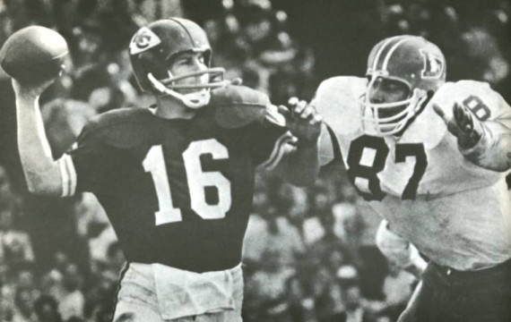 Len Dawson of the Chiefs gets set to pass as Rich Jackson of the Broncos rushes him.