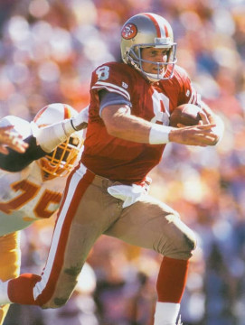 49ers quarterback Steve Young takes off running against the Bucs. In his 15-year career Young rushed for over 4200 yards and 43 touchdowns.