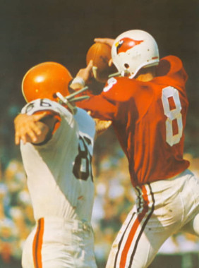 Larry Wilson makes a interception against Gary Collins of the Browns in 1966