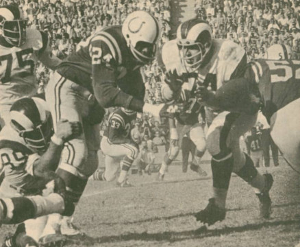 Colts - Rams in 1964. Colts Super Star Lenny Moore (#24) is held up by Rams linebacker Cliff Livingston (#85) as Merlin Olsen (#74) gets around the block of Dick Szymanski (#52) as it appears to bode unwell for the unprotected Colts runner. 