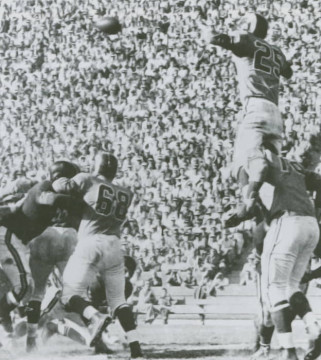 Don Burroughs (#25) gets a little help from Gene Lipscomb (#76) as the Rams defense works to block a field goal attempt.