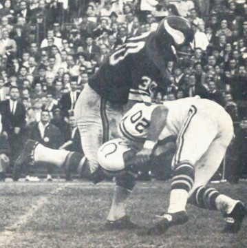 Old school NFL collision between Bill Brown (#30) and Jerry Logan (#20).