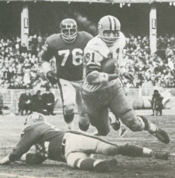 Packers great Jim Taylor runs past Giants defensive tackle Rosey Grier (#76) and over (we think) cornerback Dick Lynch. The picture is from the 1962 Giants-Packers NFL Title game. Taylor was the  games leading ground gainer with 85 yards and a touchdown as Green Bay came out on top 16-7.