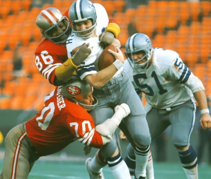 Cedric Hardeman (#86) and Charlie Krueger (#70) combine to drop Roger Staubach (#12) in Divisional Round of the 1972 NFC Playoffs. #51 is Cowboys center Dave Manders.
 Staubach entered the game late in the 3rd quarter and despite being sacked 4 times by the 49er defense, threw 2 touchdown passes as Dallas downed San Francisco 30-28.  
