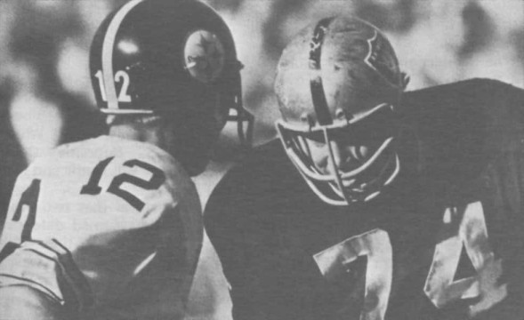 Steelers rookie Terry Bradshaw has a up close moment with Raiders defender Tom Keating in 1970.