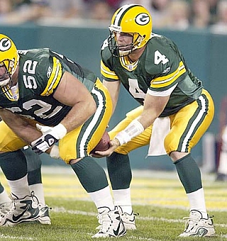 Brett Favre taking the snap from center Frank Winters