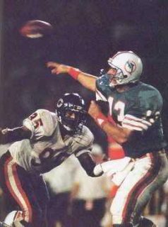 Dan Marino under pressure from the Bears Richard Dent.