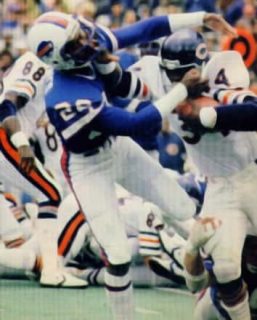 Walter Payton stiff arms a Buffalo defender.