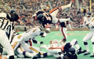 Walter Payton Goes Up & Over to Score Against the Vikings