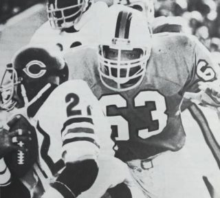 Lee Roy Selmon closes in on Dave Williams of the Chicago Bears