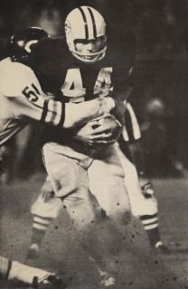Bears linebacker Dick Butkus wrapping up Packers runner Donny Anderson