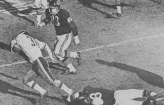 Bears linebacker Larry Morris tries to trip up Vikings runner Bill Brown.