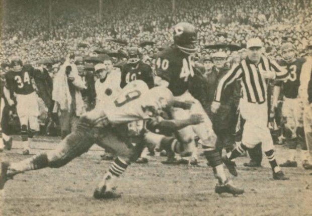 Gale Sayers scores his second touchdown against the 49ers in 1965 as Kermit Alexander tries to tackle him.