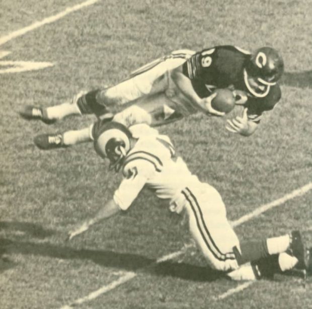 Bears tight end Mike Ditka dives over the Rams Carver Shannon after a catch