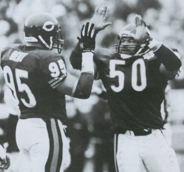 Mike Singletary and Richard Dent of the 1985 Chicago Bears Defense high-five each other