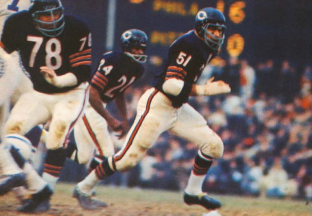 Photograph of Dick Butkus, Stan Jones and Rosey Taylor during the mid-1960s