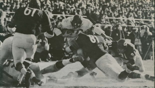 Doug Atkins stops Joe Morrison for no gain in the 1963 NFL Championship game.