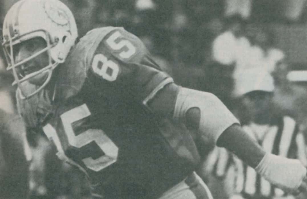 Black and white photo of the Dolphins Nick Buonticonti during a play.