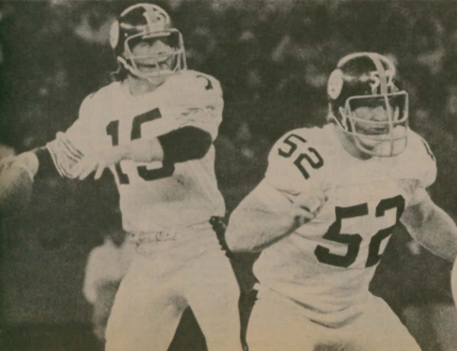 Old photo of Mike Webster pass-blocking for rookie Steeler quarterback Mike Kruczek.