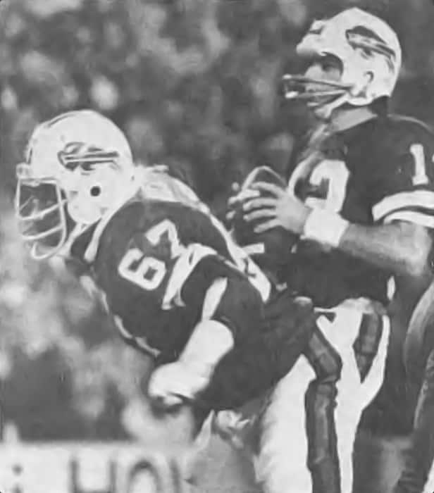 Reggie McKenzie blocks for Buffalo Bills quarterback Joe Feruson in 1975