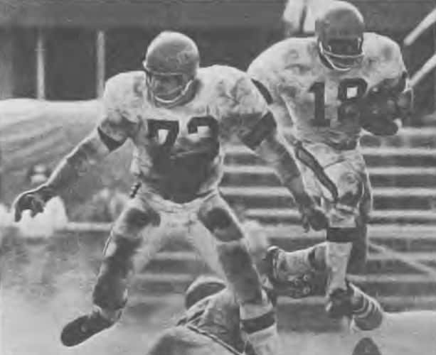 AFL Rookie Paul Robinson behind the blocking of Paul Matson in 1968.