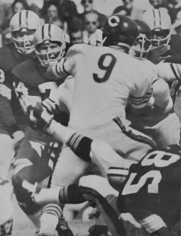 Billy Wade is rushed by Henry Jordan and the Green Bay Packers defense in 1963.