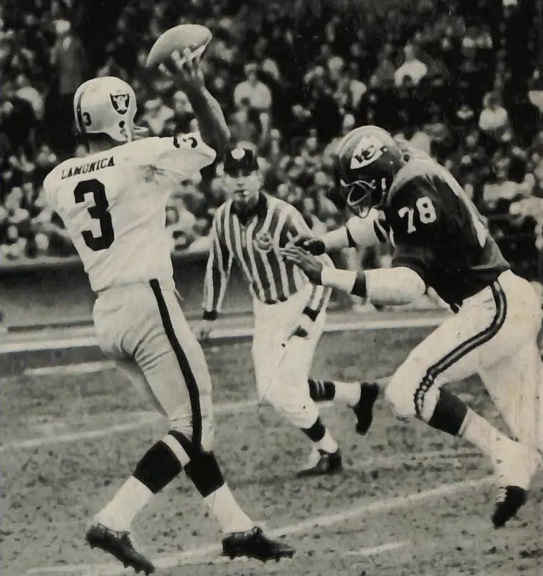 Daryle Lamonica rushed by Bobby Bell of the Chiefs