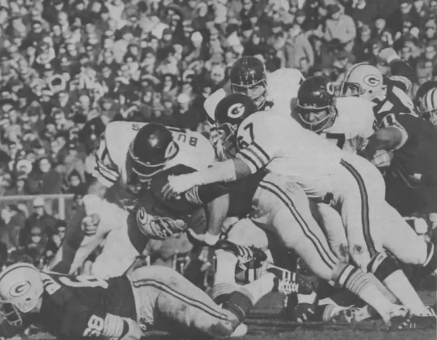 Picture of Dick Butkus and the Bears Defense Stopping a Packer Runner in 1972