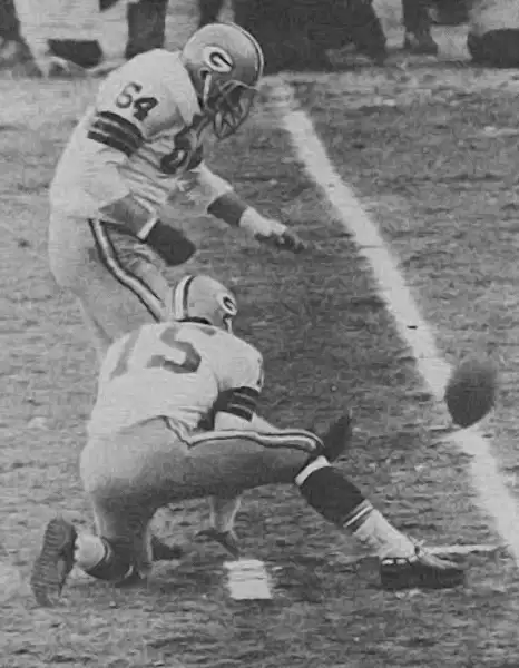 Packers Jerry Kramer kicking with Bart Starr holding