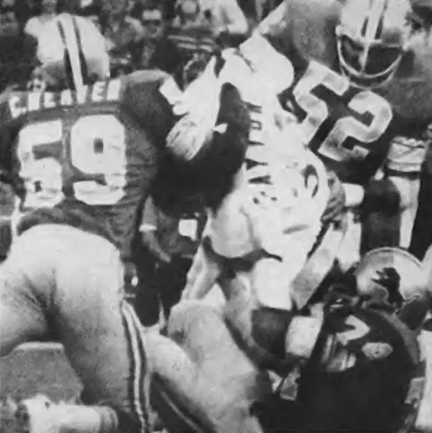 Picture of Walter Payton getting stopped by the Detroit Lions defense in 1977