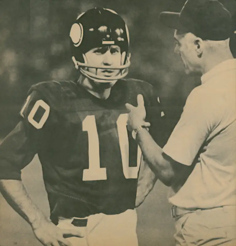 Quarterback Fran Tarkenton and Head Coach Bud Grant talk things over on the Vikings sideline in 1972. After 5 seasons with the Giants Tarkenton rejoined his former team in 1972 and would lead them to 3 NFC Titles over the next 5 seasons.