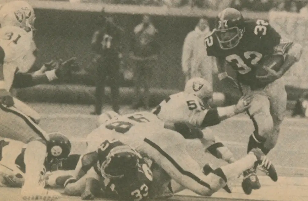 Franco Harris follows John Fuqua block against the Oakland Raiders Defense