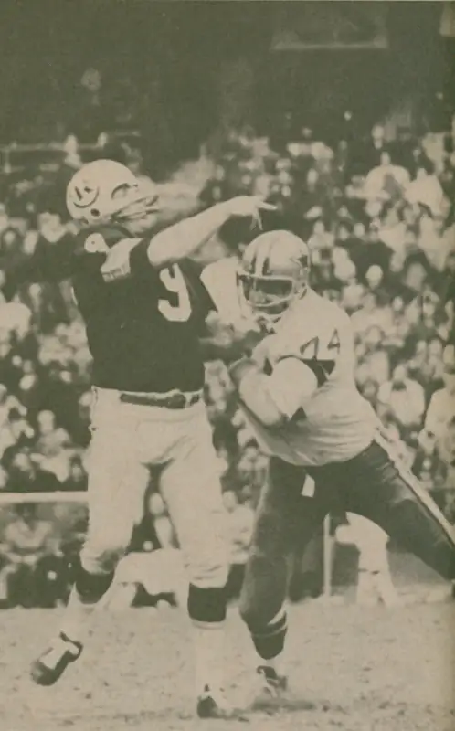 Sonny Jurgensen, Washington Redskins quarterback gets the pass away in time as Bob Lilly of the Dallas Cowboys presses the issue. In 18 NFL seasons Jurgensen had 255 touchdown passes. Lilly, in 14 seasons, is credited "unofficially" with 95½ sacks.