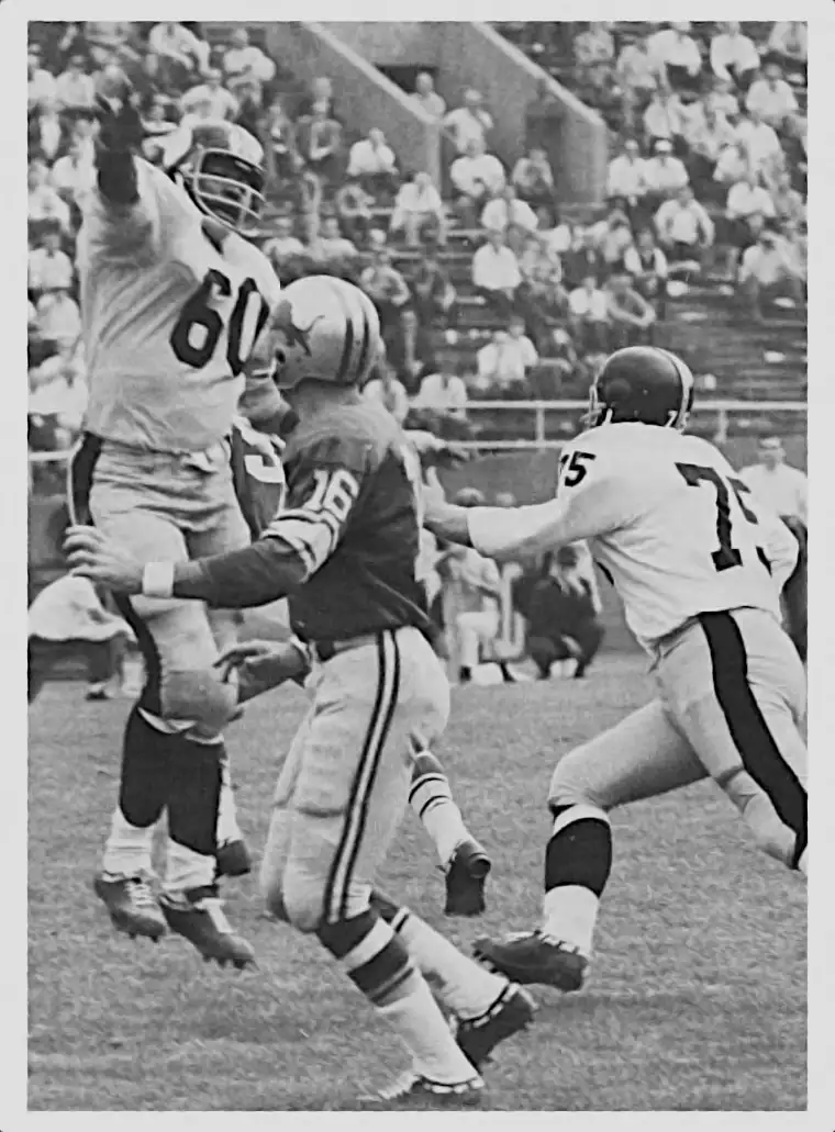 Lions quarterback Milt Plum gets this one away as Steelers Ben McGee and Ken Kortas press the issue.