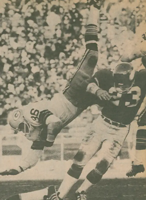 Probably from 1973, Viking Safety Jeff Wright sends Packers runner MacArthur Lane into the air. Wright was a 15th round draft pick of the Vikings in 1971 and played 83 games for Minnesota